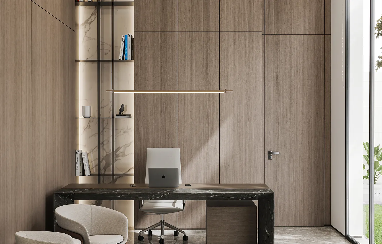 Home office interior design featuring built-in shelves and wood panelled walls in Dubai.