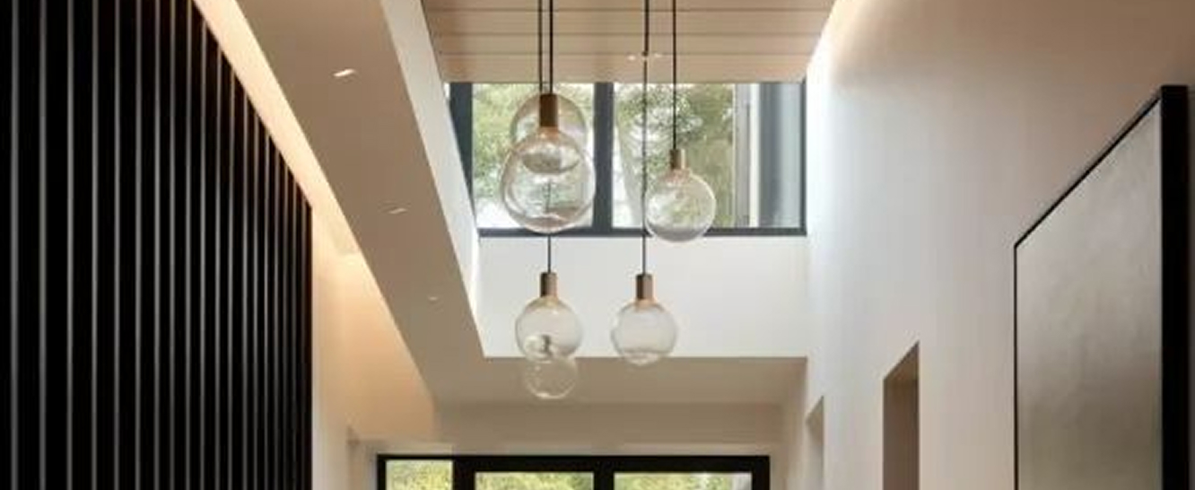 High-end residential interior design of a Palm Jumeirah villa living room with floor-to-ceiling windows.