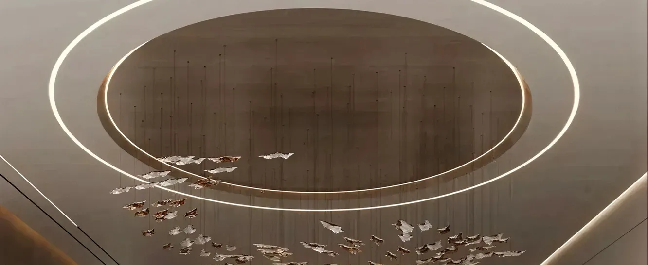 Contemporary foyer interior featuring layered lighting in a luxury villa.