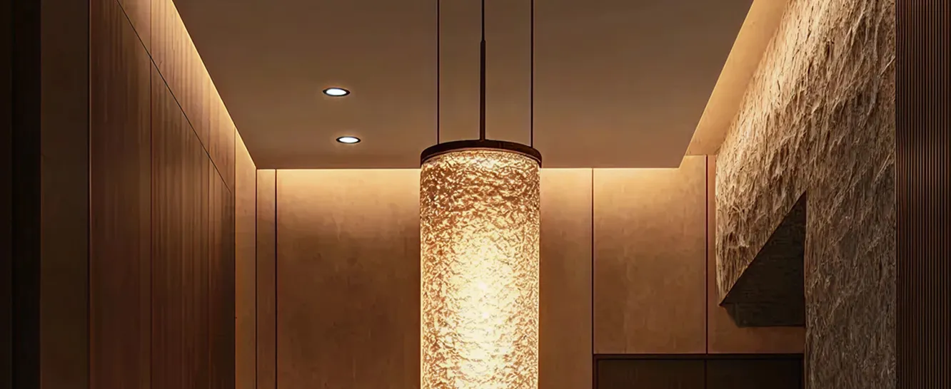 Contemporary entrance interior design featuring a pendant and illuminated ceiling.