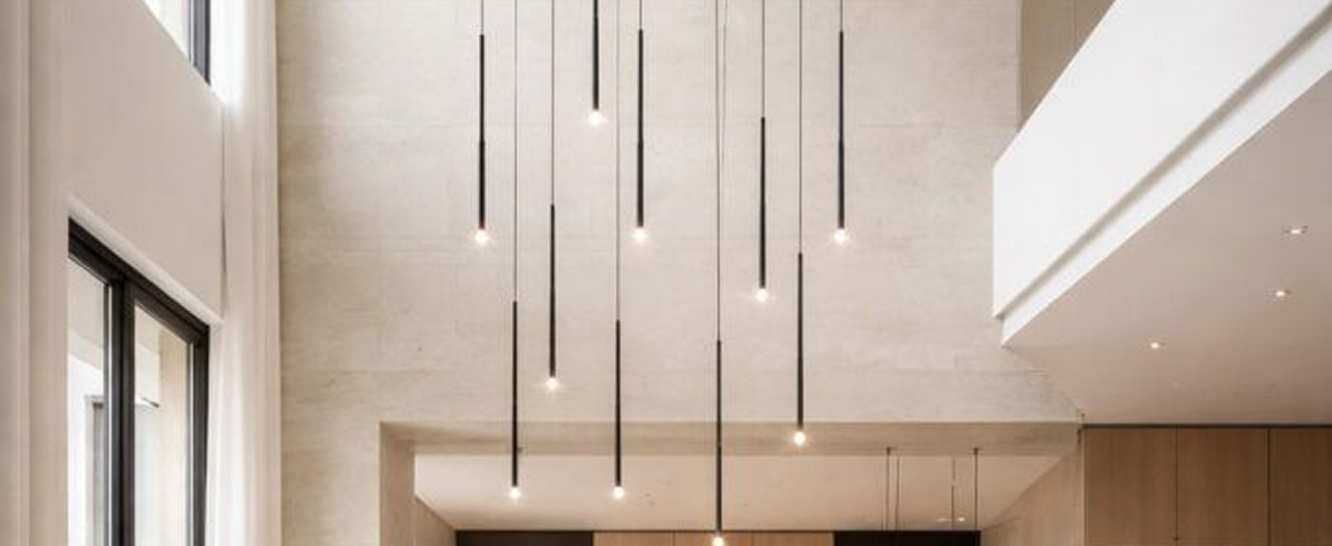 High-end residential interior design of a Palm Jumeirah villa living room with floor-to-ceiling windows.