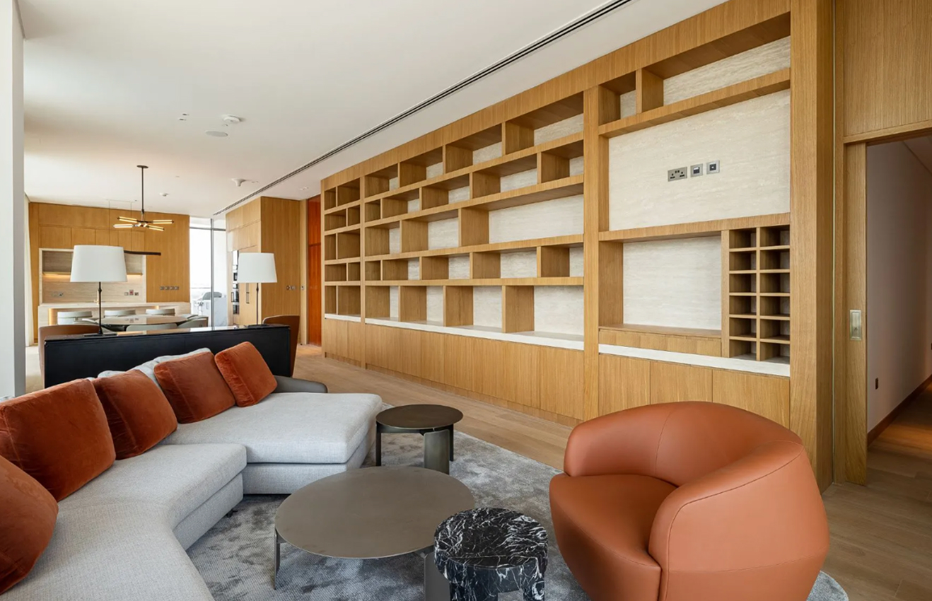 High-end residential interior design of a Palm Jumeirah villa living room with floor-to-ceiling windows.