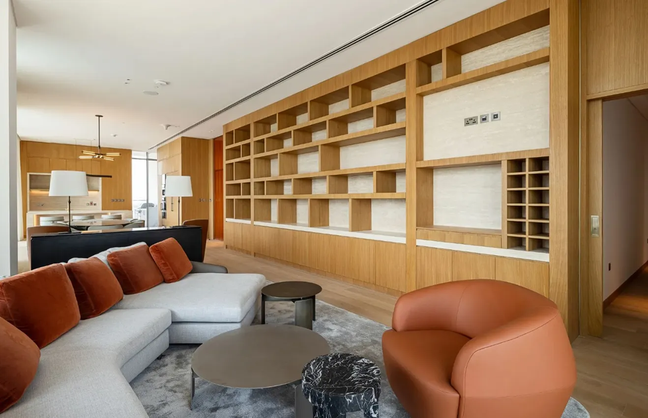 Luxury villa turnkey living room interior with double-height ceiling and marble finishes.