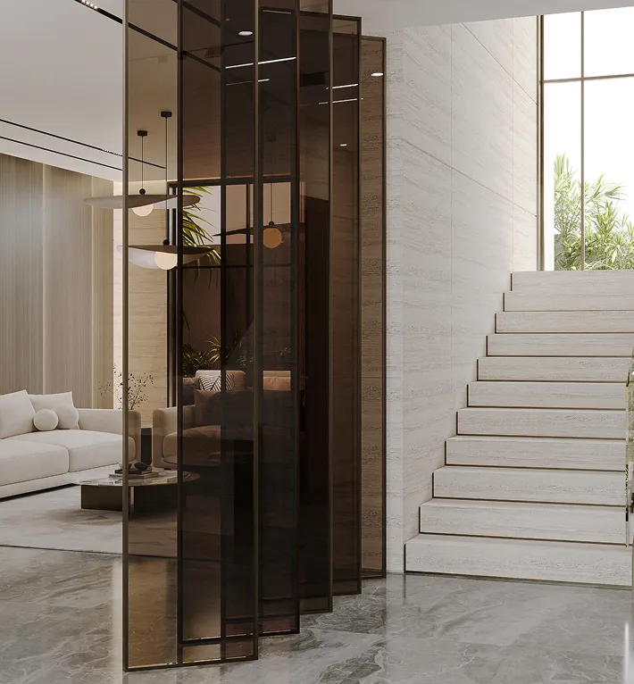 Modern villa interior design featuring a floating travertine staircase and glass railing in Dubai.