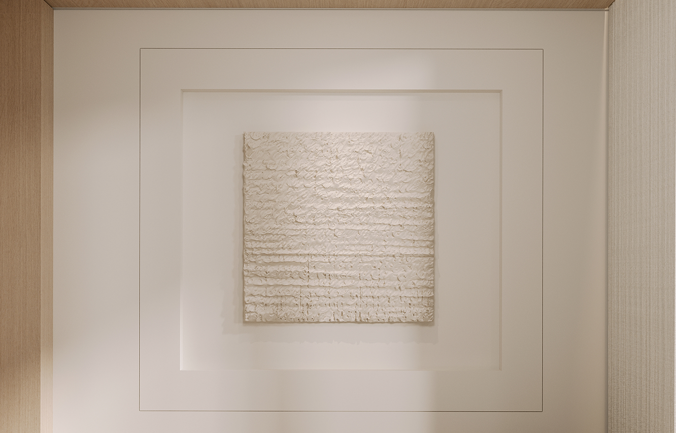 Modern bath featuring a stone feature wall and glass shower partition in a luxury villa.