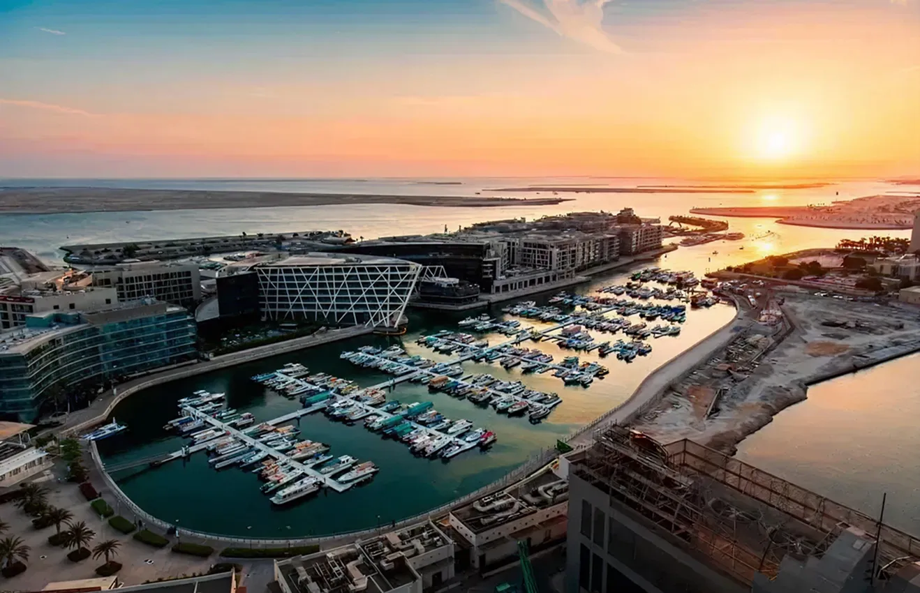 Waterfront residential development highlighting modern apartment interiors in Abu Dhabi.