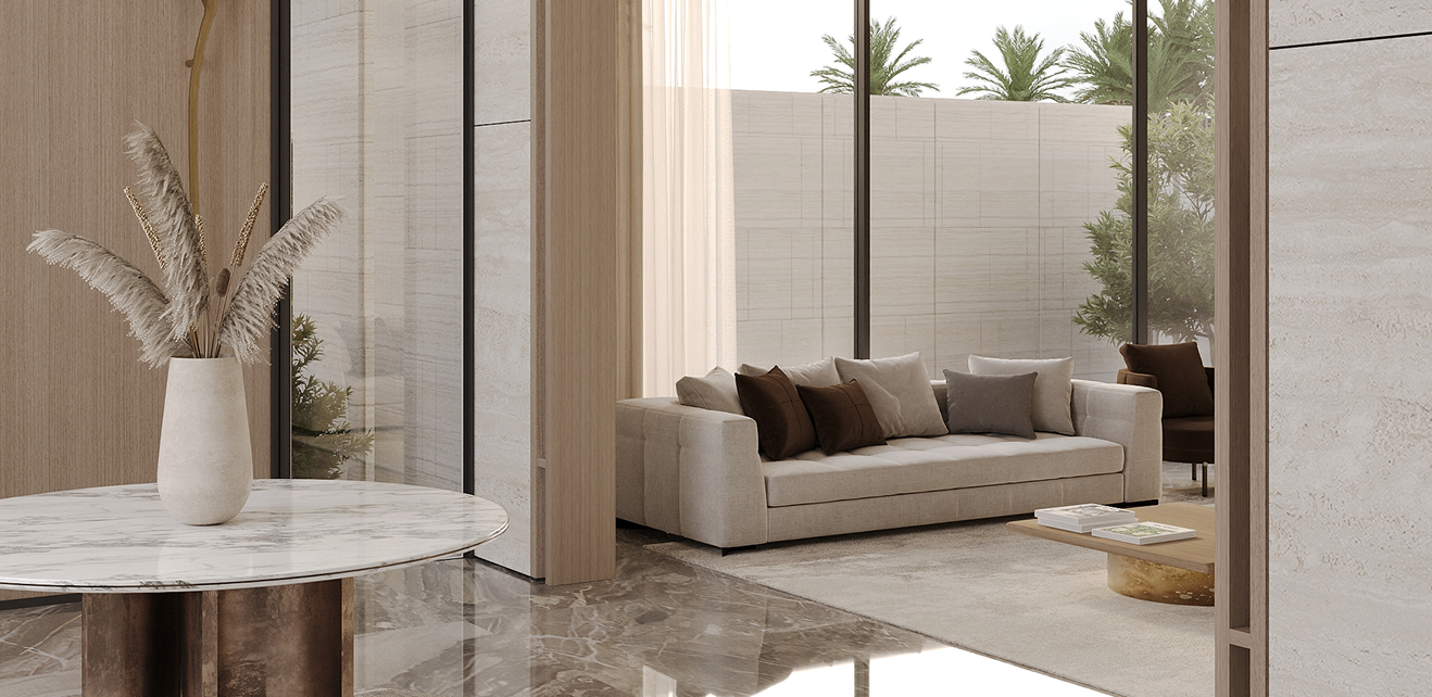 Minimalist bathroom interior featuring a freestanding tub and natural stone basin in Dubai.