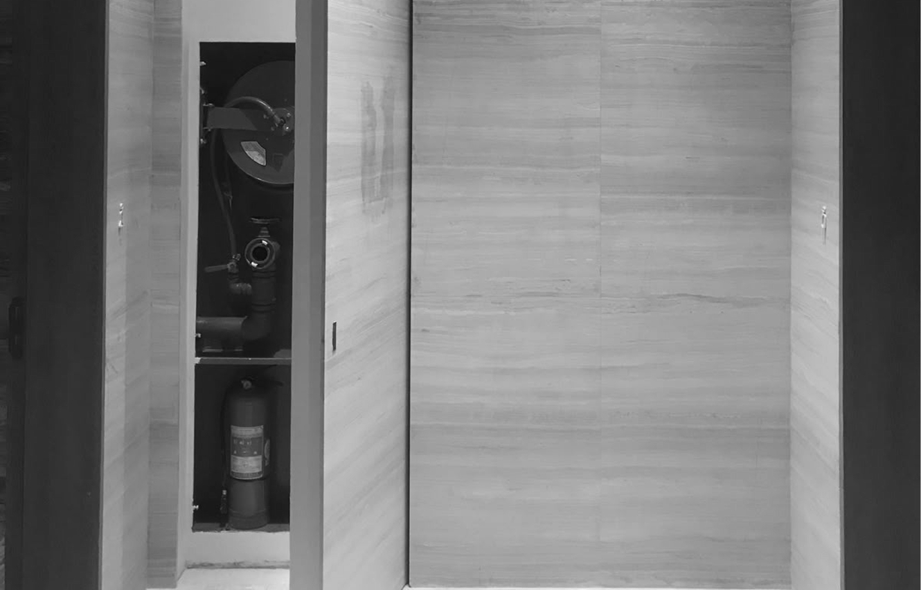 Luxury bathroom interior design featuring a freestanding tub and natural stone wall.