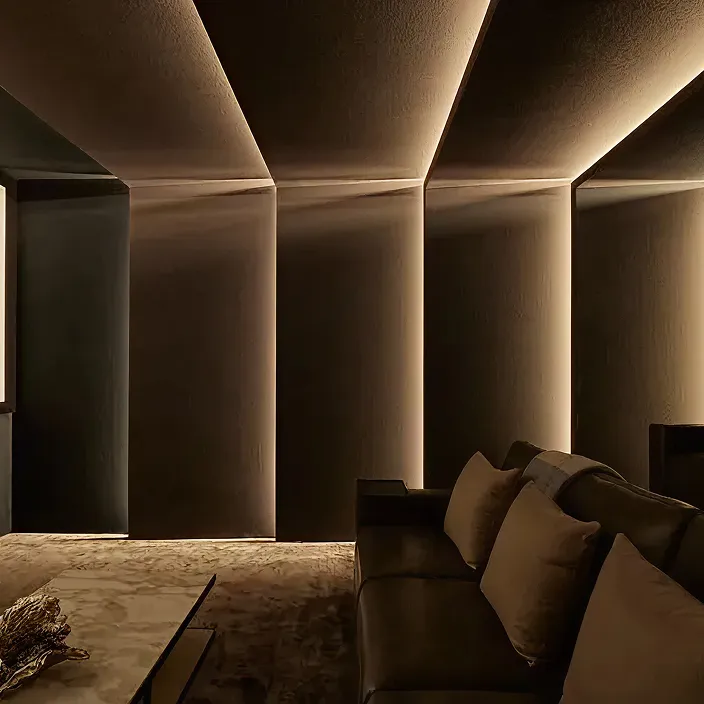 Luxury home theater room interior featuring layered recliners and premium finishes in Dubai.