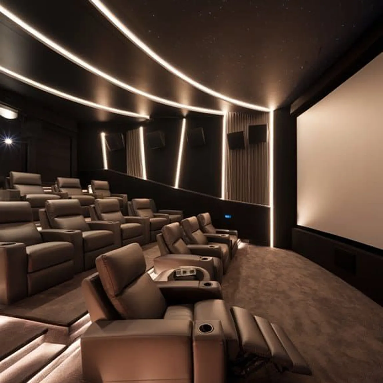 Illuminated LED lighting in a modern home cinema room interior design by Rafitout.