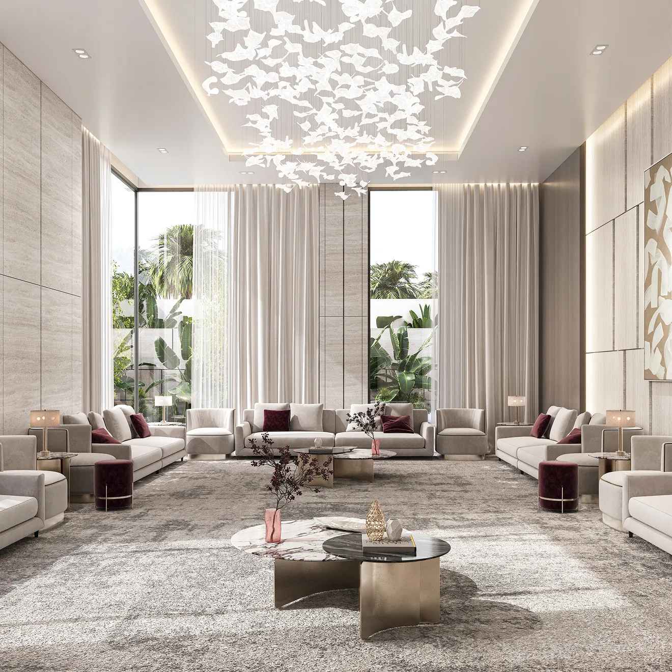 Modern high-ceiling majlis interior featuring custom seating and a statement chandelier.