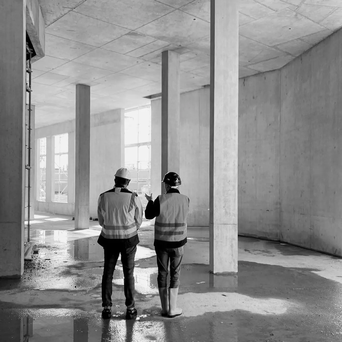 Rayfitout site team reviewing progress inside an interior fit out project in Abu Dhabi.