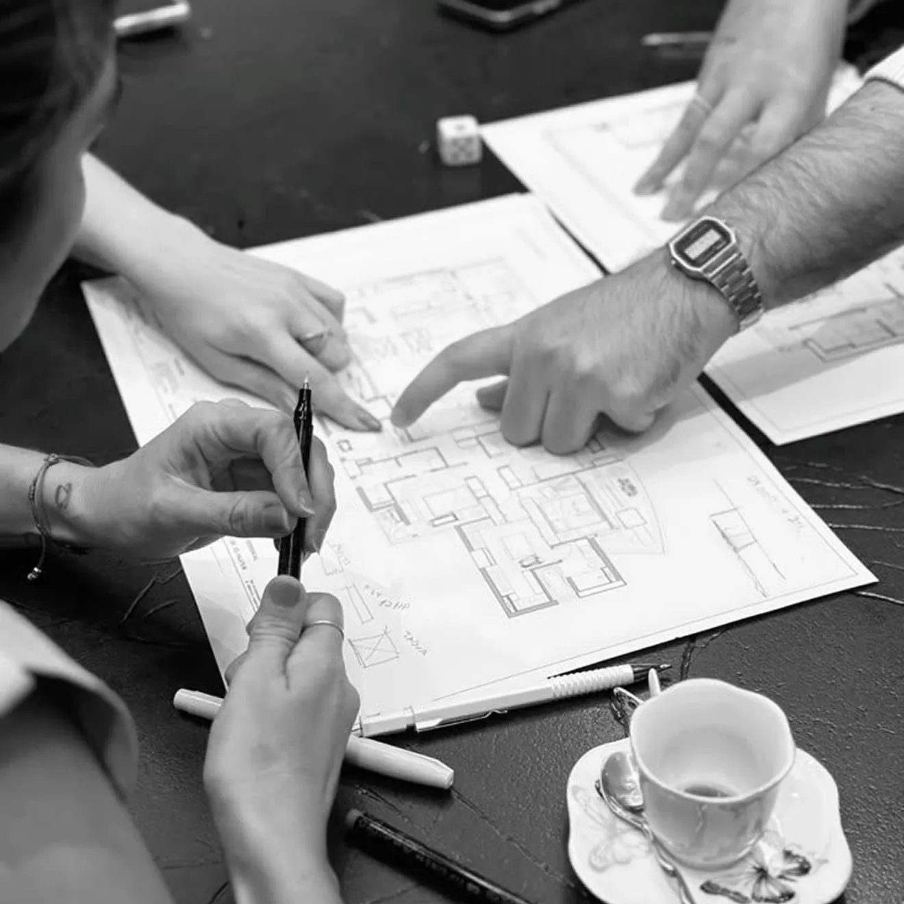 Rayfitout team coordinating interior fit out details using architectural drawings.