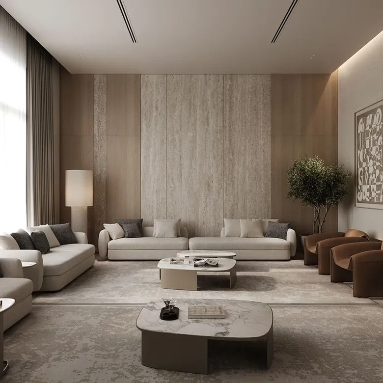 Modern villa interior featuring travertine accent wall and leather armchairs.
