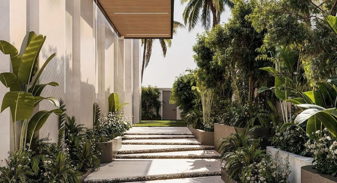 Minimalist living room interior design with floor-to-ceiling windows.