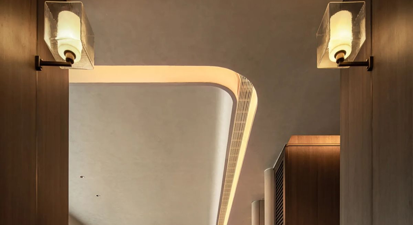 Minimalist living room interior design with floor-to-ceiling windows.