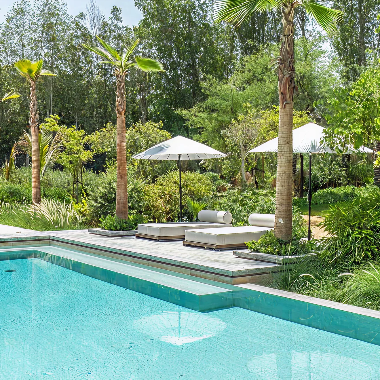Minimalist living room interior design with floor-to-ceiling windows.