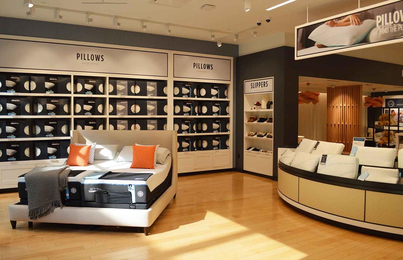 Minimalist living room interior design with floor-to-ceiling windows.