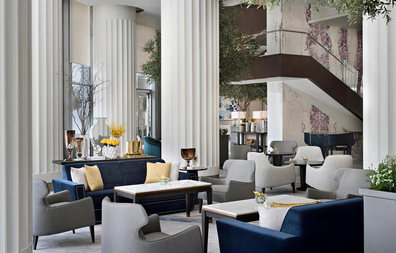 Minimalist living room interior design with floor-to-ceiling windows.