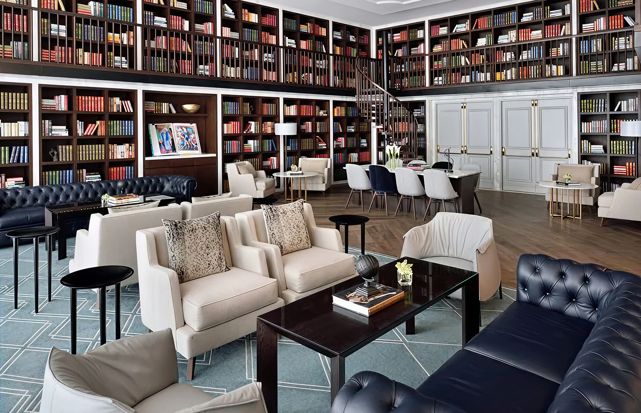 Minimalist living room interior design with floor-to-ceiling windows.
