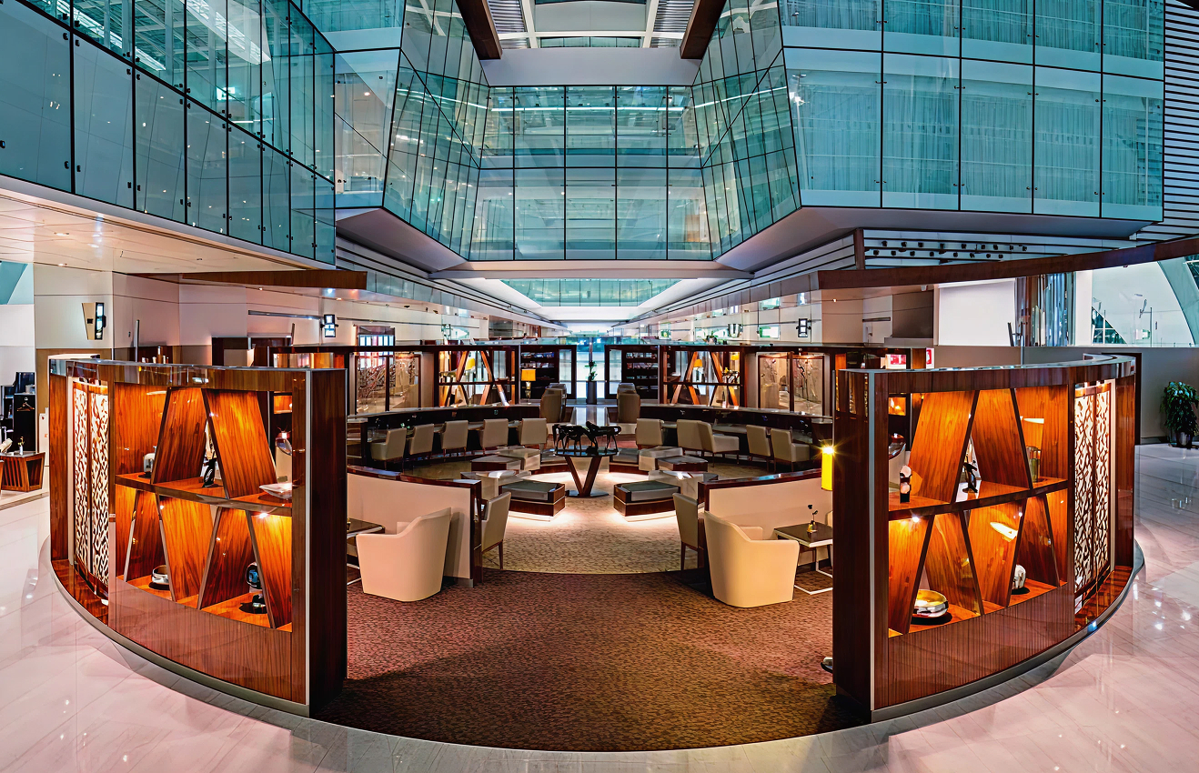 Minimalist living room interior design with floor-to-ceiling windows.