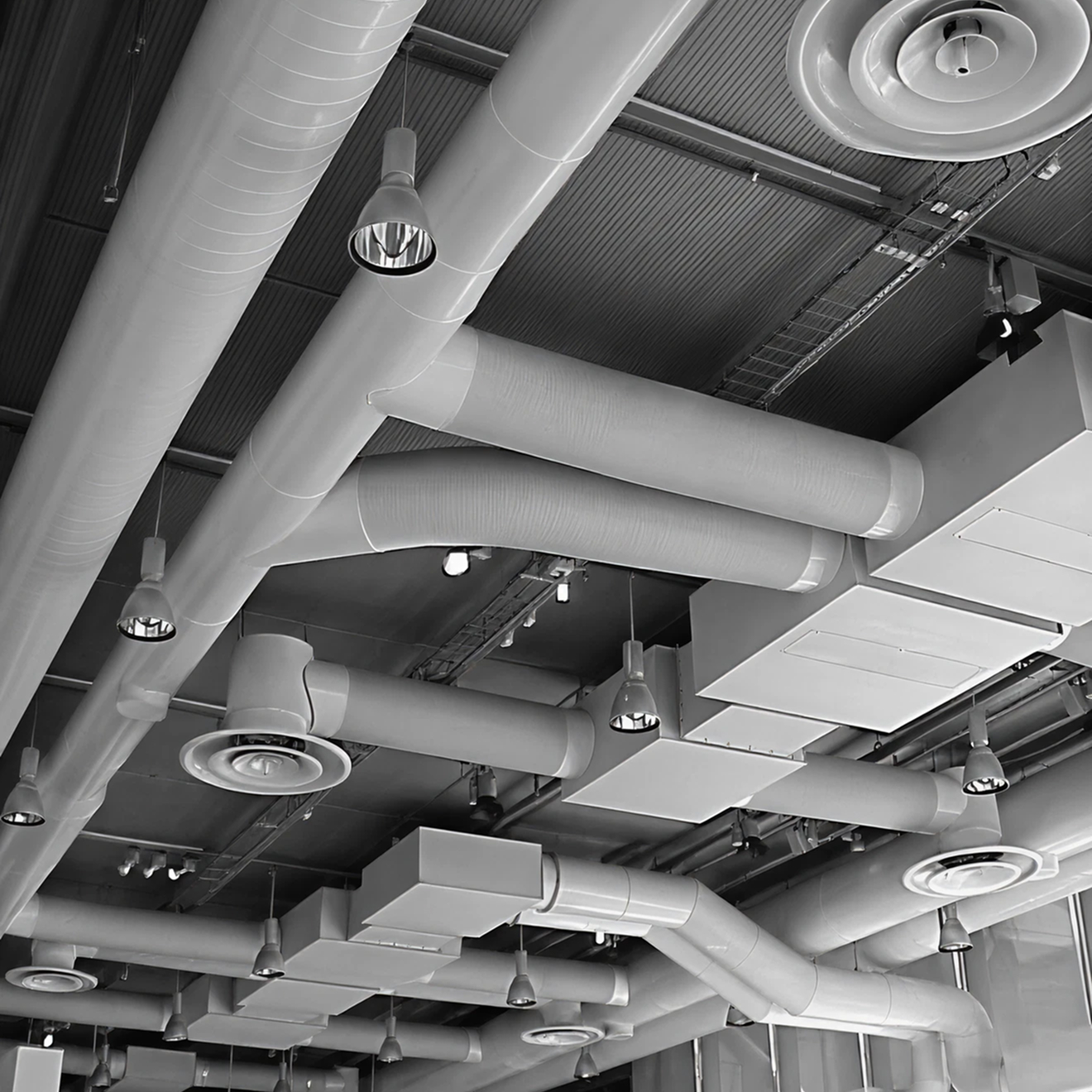 Detailed view of plumbing and HVAC pipes