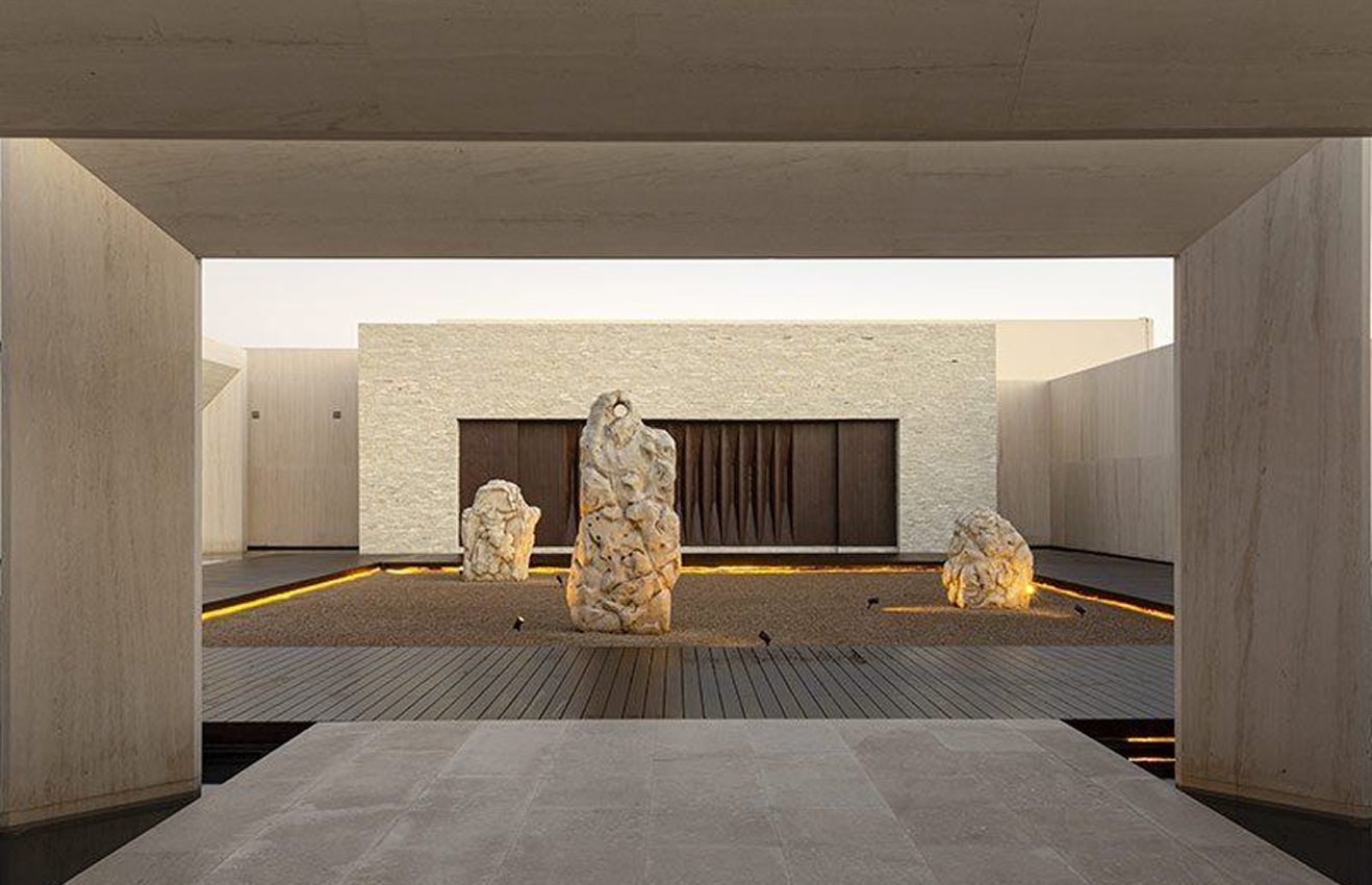 Minimalist living room interior design with floor-to-ceiling windows.