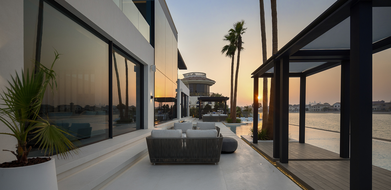 Minimalist living room interior design with floor-to-ceiling windows.