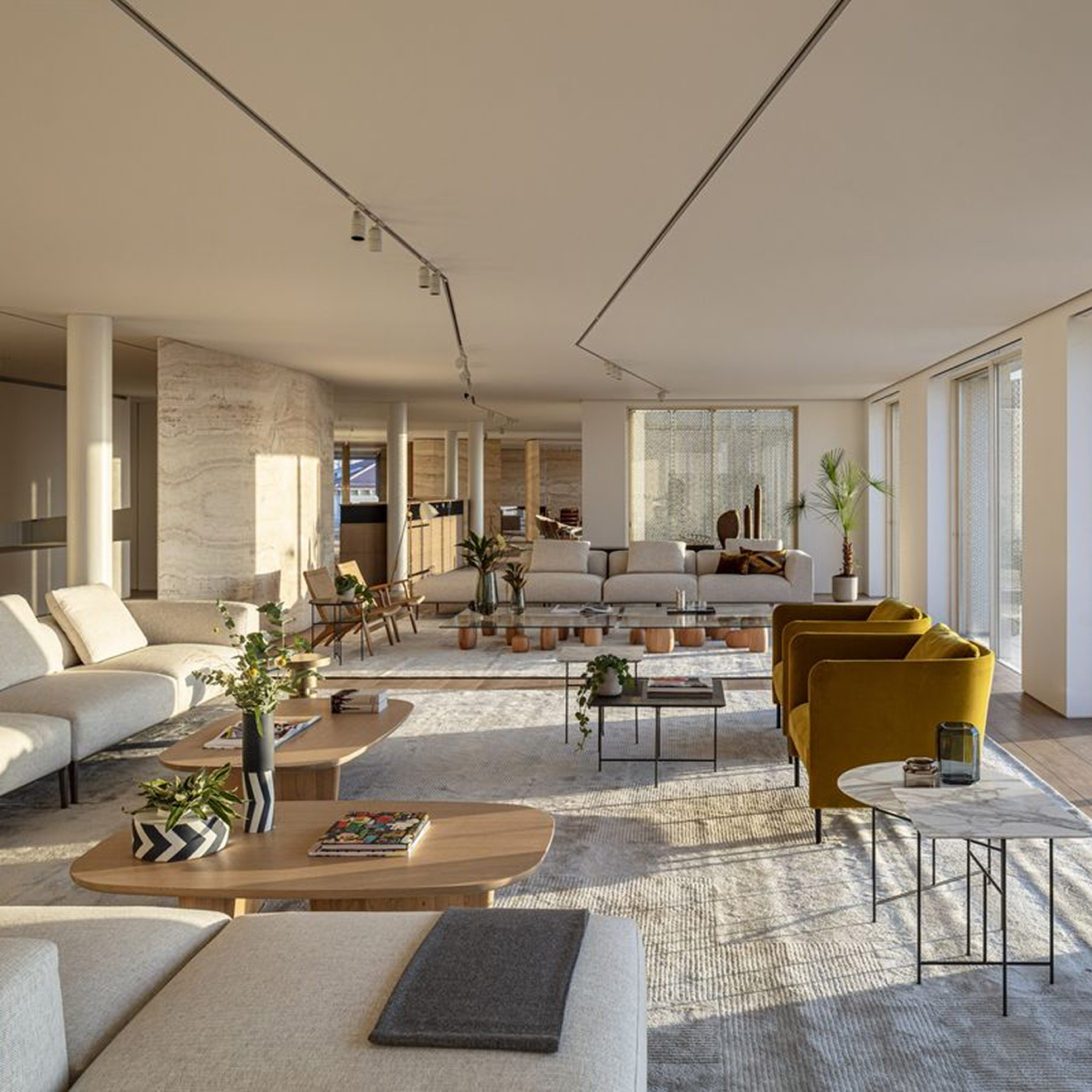 Minimalist living room interior design with floor-to-ceiling windows.