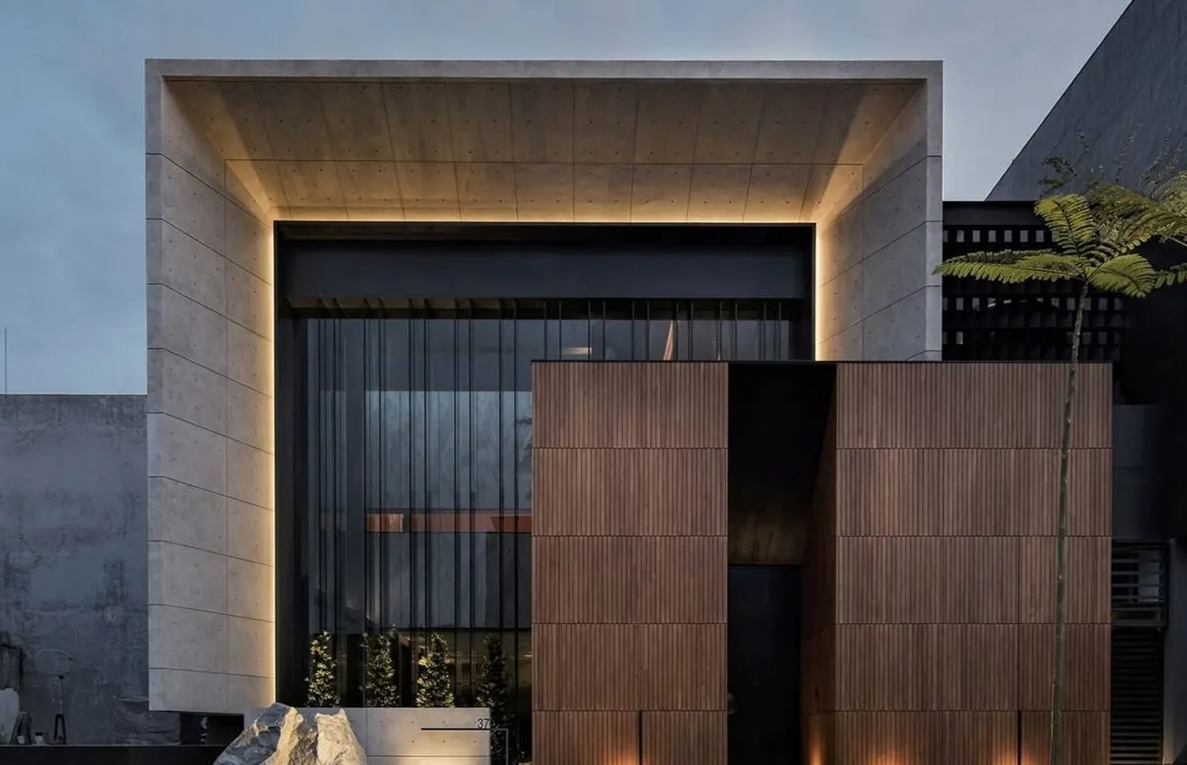 Minimalist living room interior design with floor-to-ceiling windows.