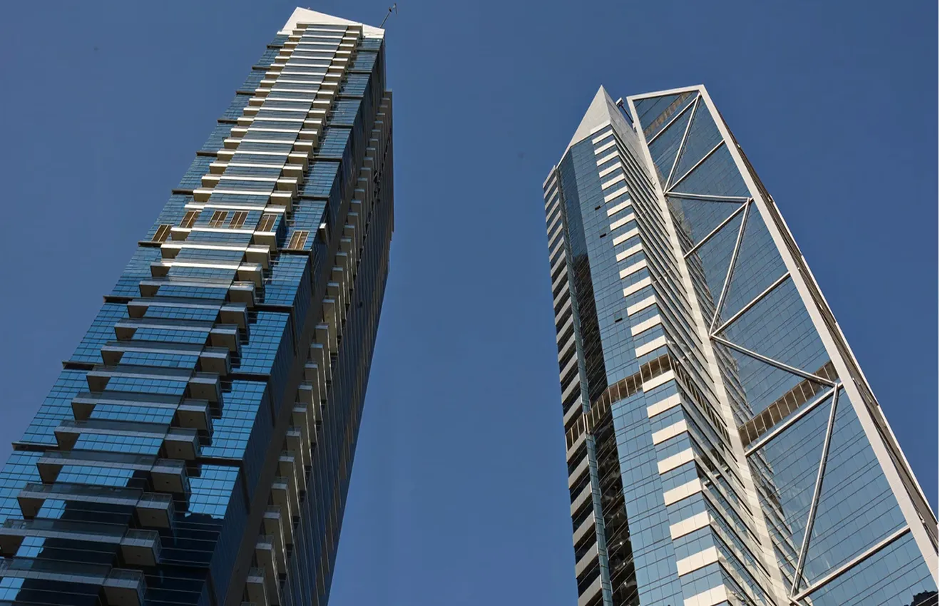 Minimalist living room interior design with floor-to-ceiling windows.