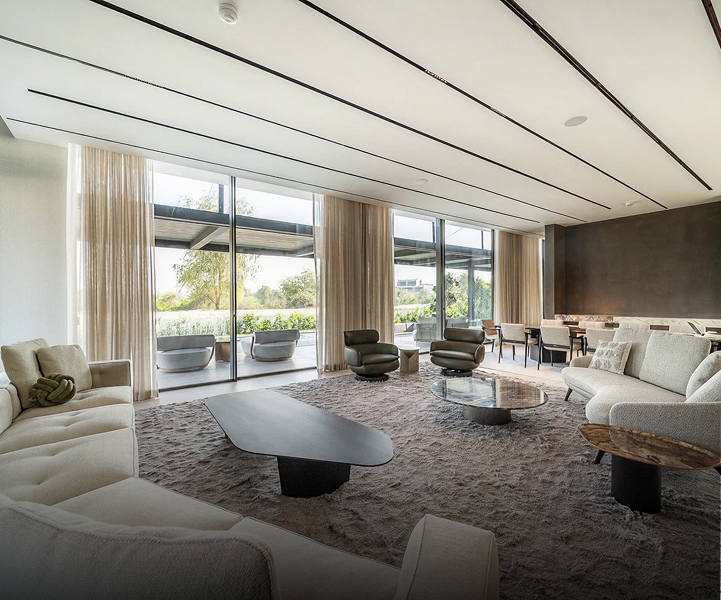 Private villa living room interior design featuring bespoke furnishing in Dubai Hills.