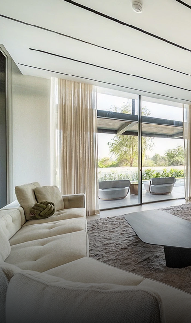 Modern villa interior featuring custom ceiling design and bespoke joinery by Rayfitout.