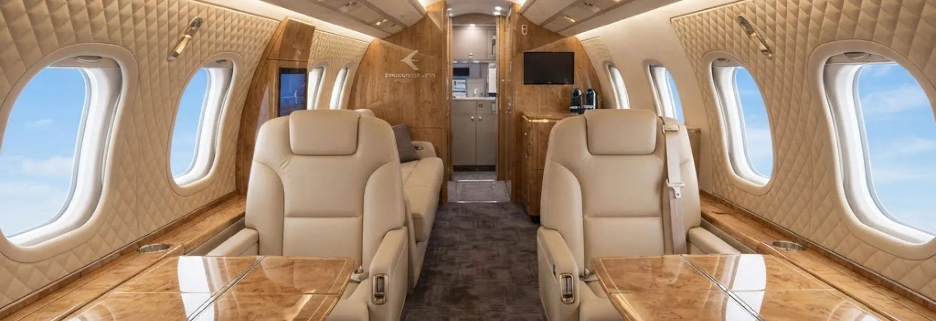Embraer executive jet cabin with bespoke quilted seating