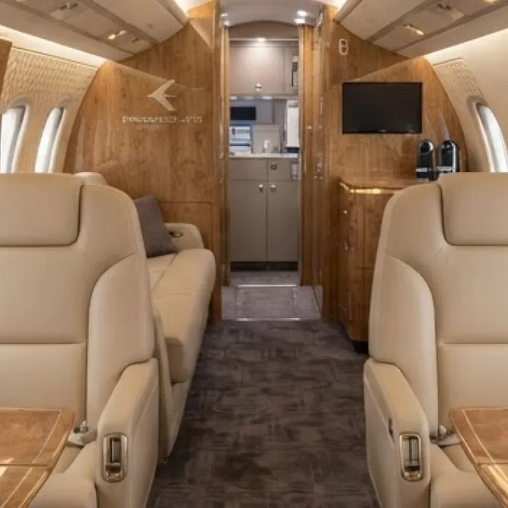 Embraer executive jet cabin with bespoke quilted seating