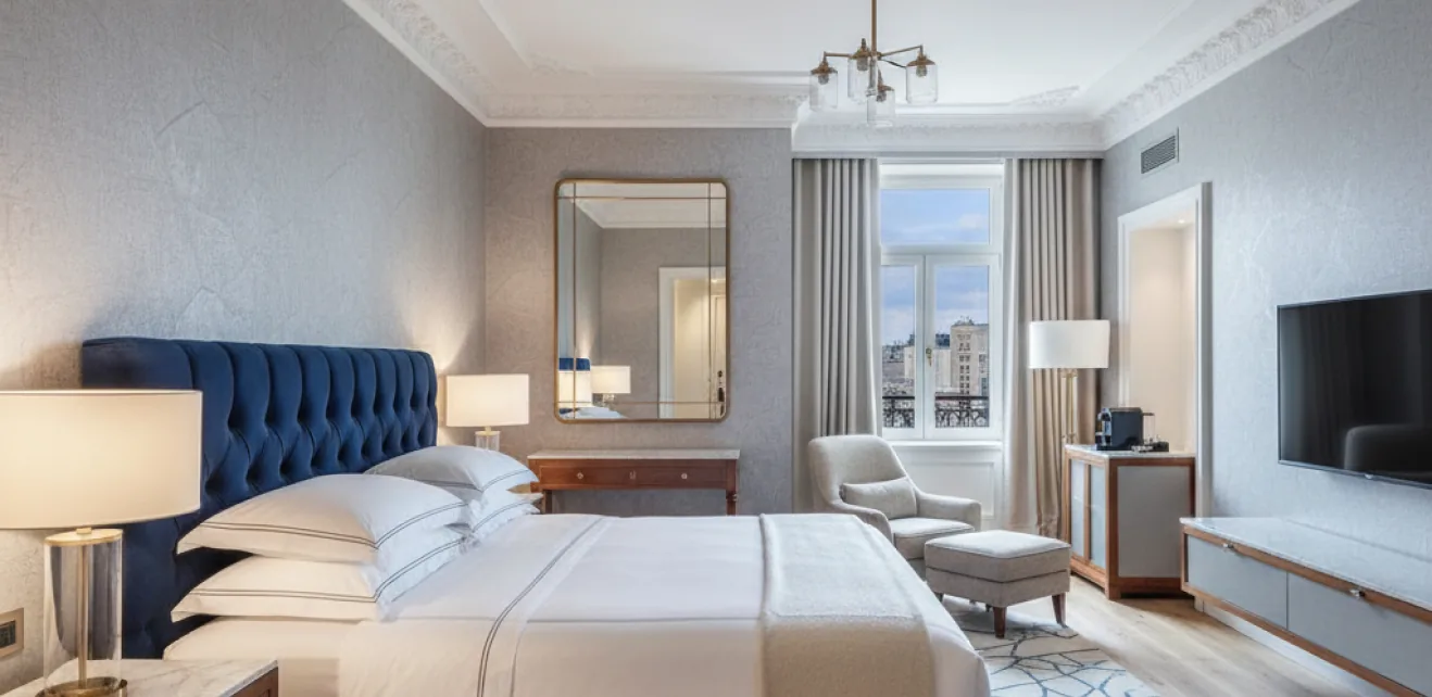 Renovated hotel guest room with blue headboard