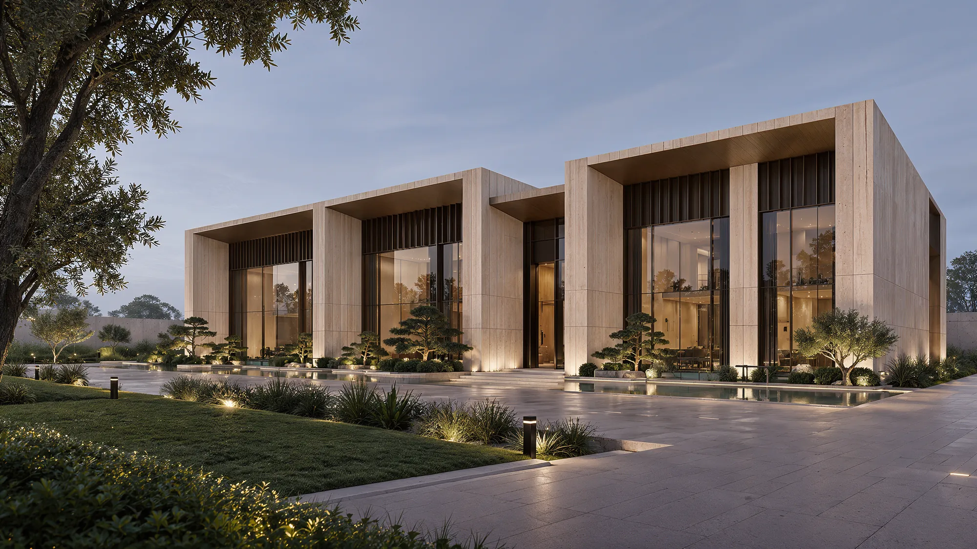 Luxury villa exterior at dusk with landscaped garden, by Rayfitout, a luxury interior designer in Ivory Coast