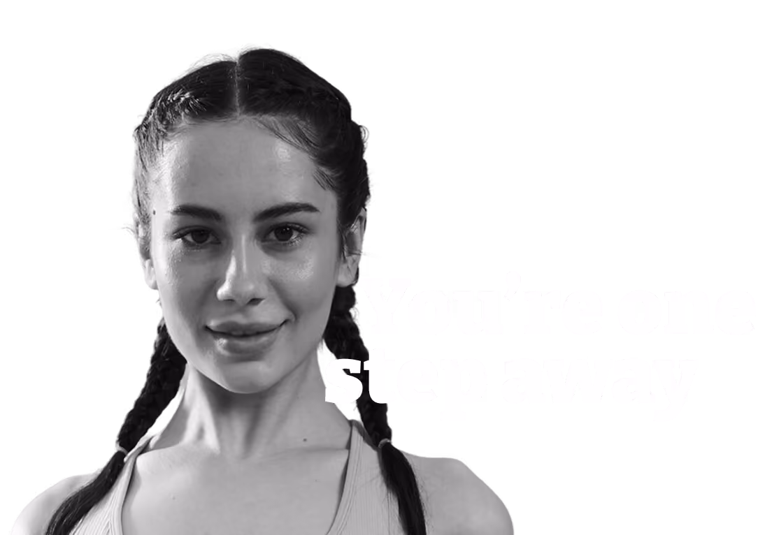 Woman in headband demonstrating a boxing pose with text 'There's one step away' on black background.