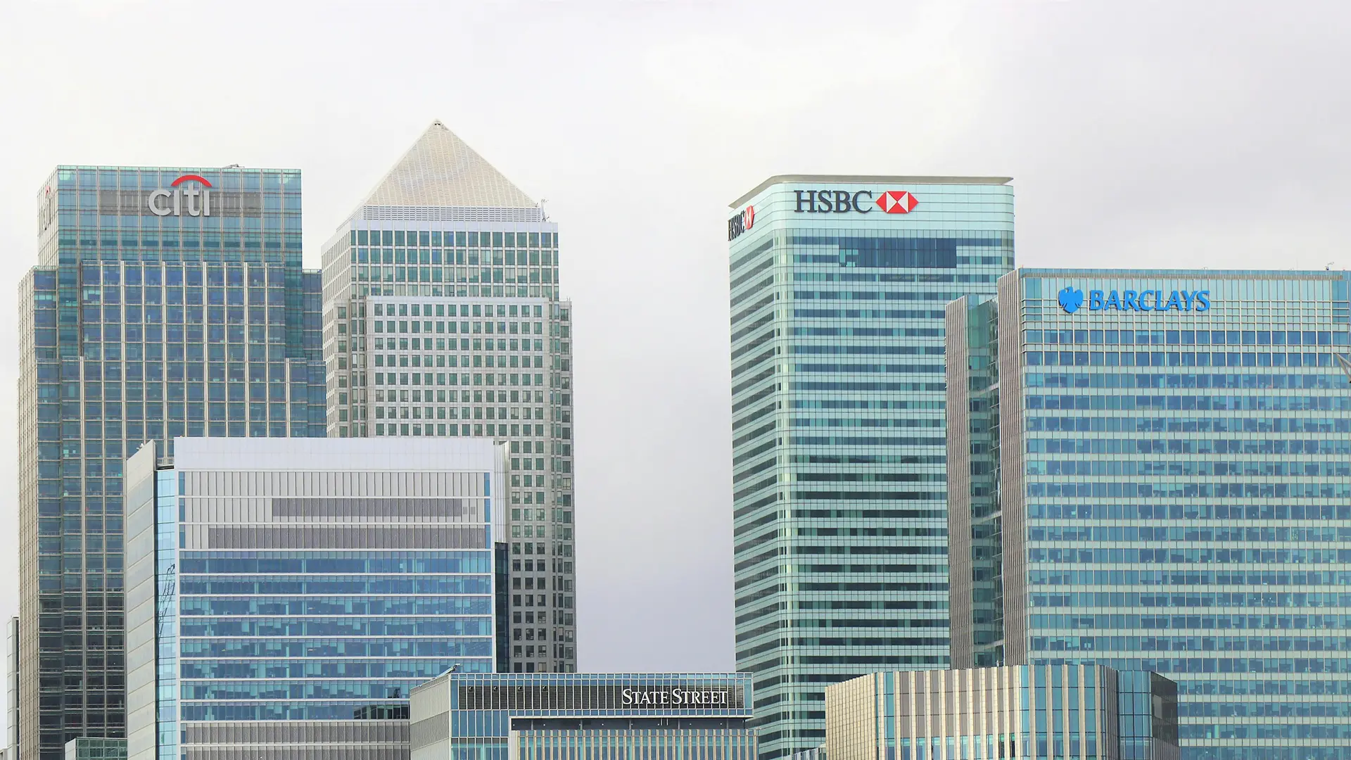 Skyscrapers of major international banks like Citi, HSBC, and Barclays representing options to open a bank account in Dubai from India