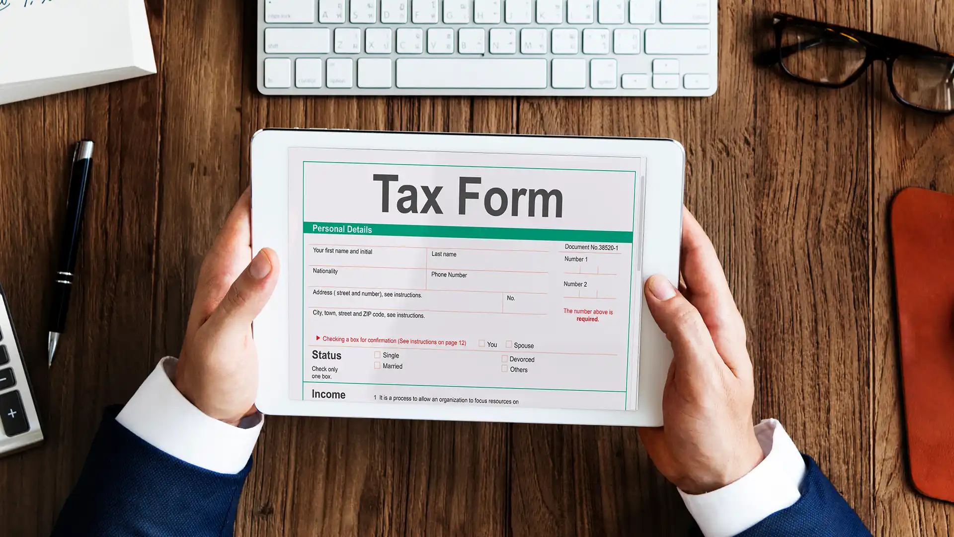 Professional reviewing VAT in UAE documentation on desk