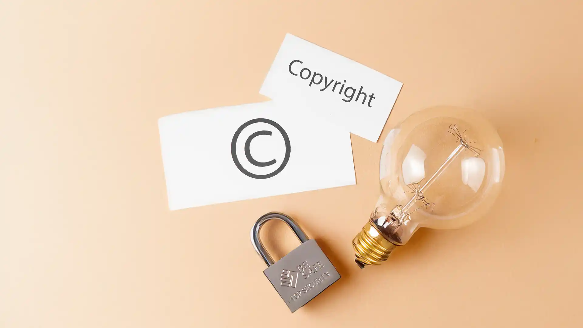 Conceptual image of copyright protection with light bulb and padlock