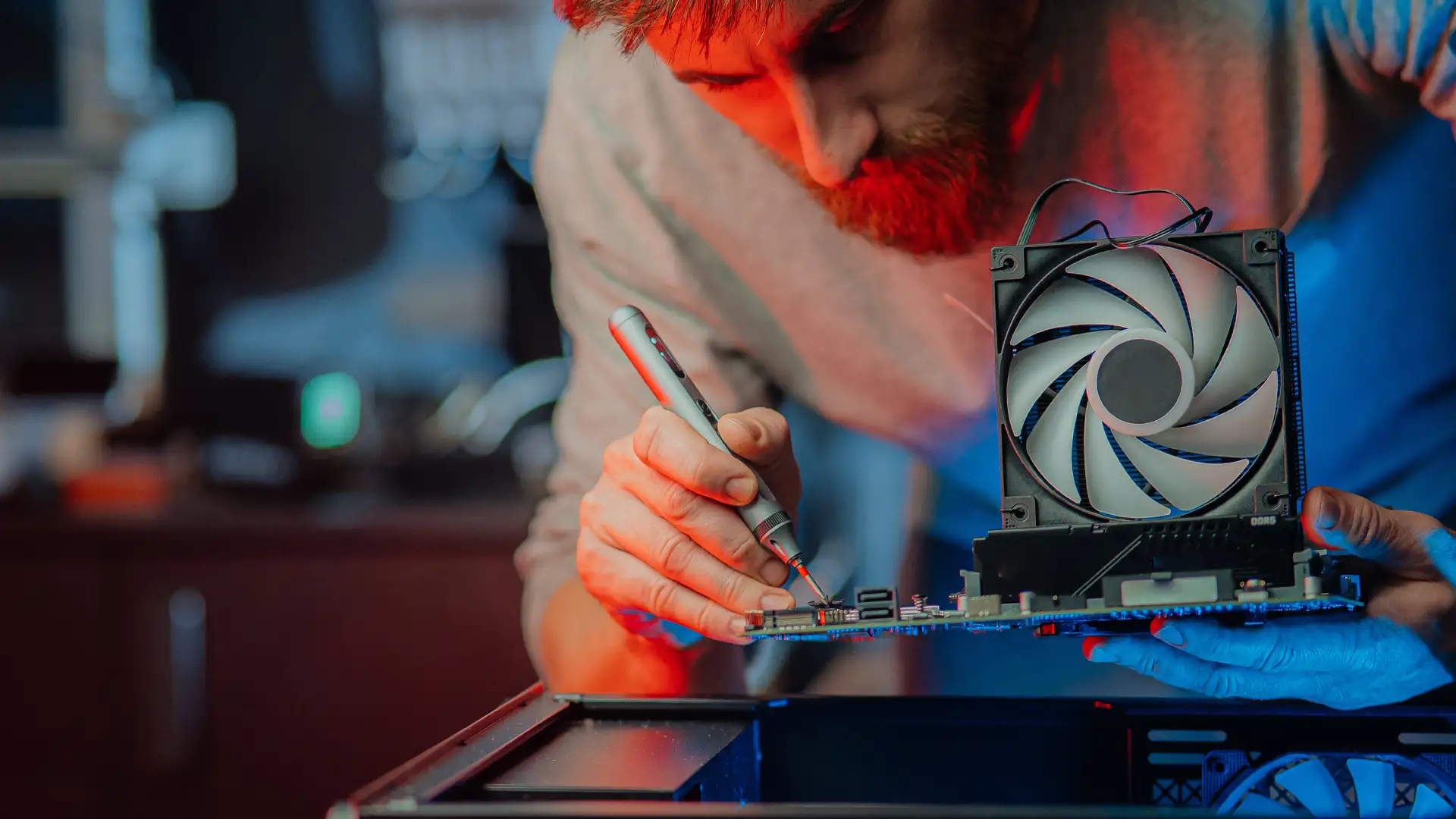 Man fixing computer, Computer Repair and maintenance business in dubai