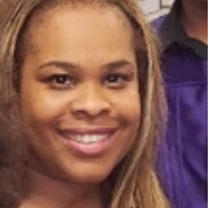 Ms. Inlaw smiling staff member at PS 130 Bronx