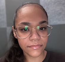 Headshot of Ms. Marte wearing glasses