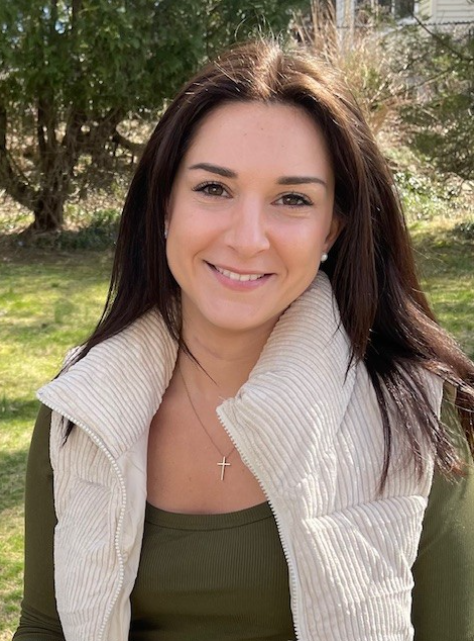 Ms. Cappelli smiling outdoors in a staff directory photo