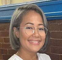 Ms. Abby smiling staff portrait at PS 130 Bronx
