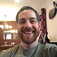 Mr. Gargani smiling in a casual indoor setting