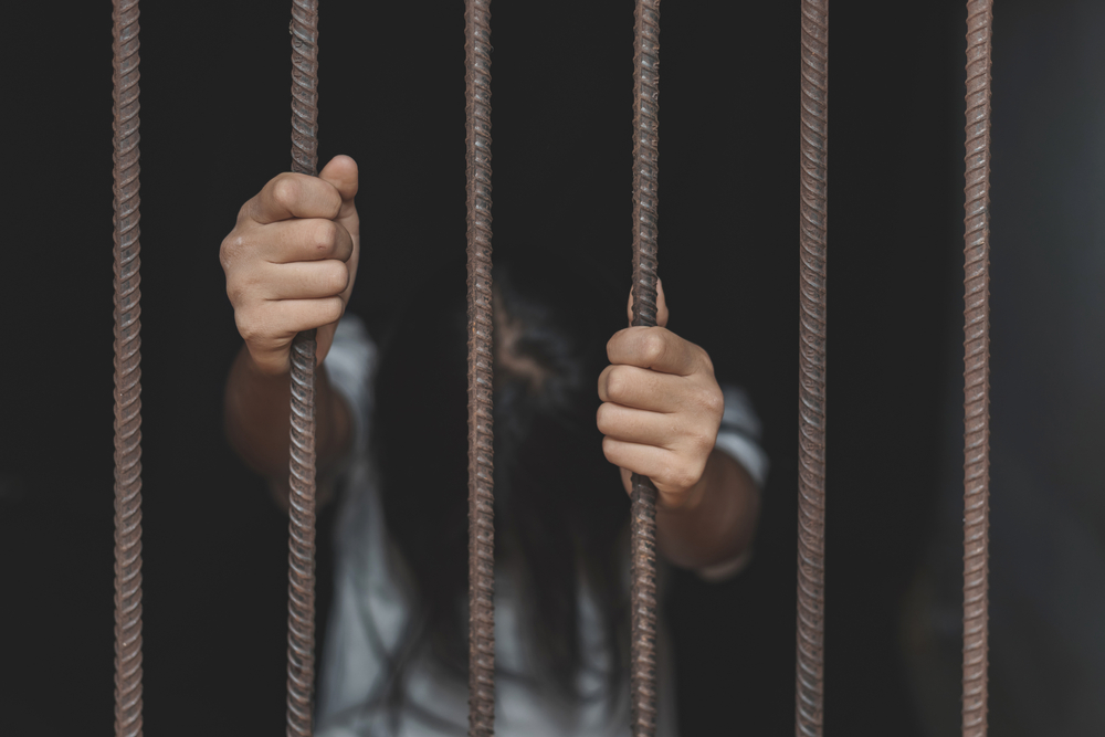 Woman in a steel cage