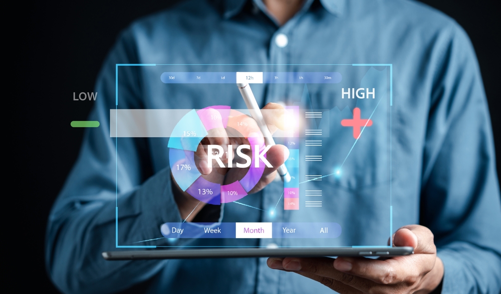 Digital image of a risk meter overlayed over a man's torso, blue business shirt