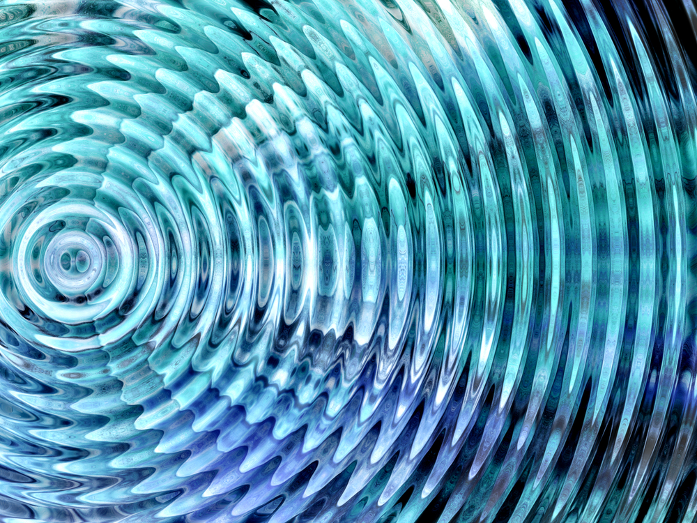 Mix of blues evoking water forming a vibratory circle from a center point.